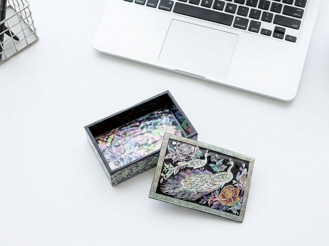 Open Korean mother-of-pearl najeonchilgi keepsake box showing its decorated interior