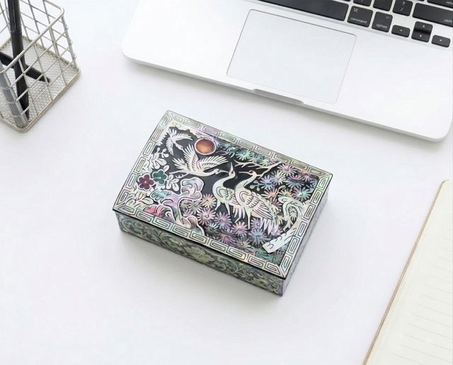 Korean mother-of-pearl najeonchilgi box on a modern desk